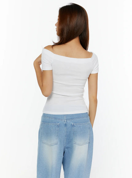 Off-Shoulder Fitted Top CL515 White back model standing showing ribbed back seam short sleeves and off-shoulder neckline detail
