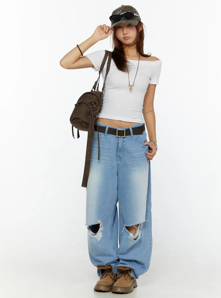 Off-Shoulder Fitted Top CL515 White full-body front model standing with bag cap and ripped wide-leg jeans street style outfit