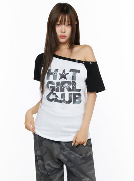 Off-Shoulder Graphic Print Top IL523 White half-body front shot on model with hand at hip asymmetric off-shoulder neckline black raglan sleeves star stud trim