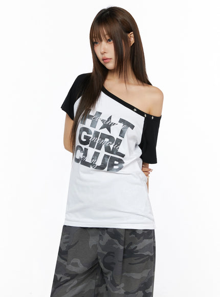 Off-Shoulder Graphic Print Top IL523 White three-quarter side-front shot on model tilted pose showing off-shoulder silhouette black raglan sleeves star studs