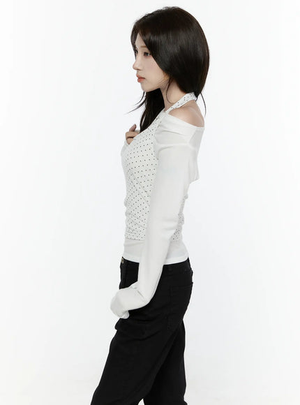 Off-Shoulder Halter Layered Top IL521 White side shot on model hand on chest showing layered halter silhouette polka dot overlay and off-shoulder long sleeve detail