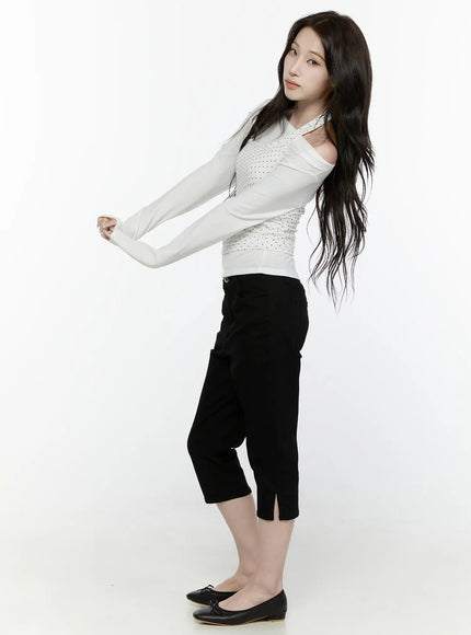 Off-Shoulder Halter Layered Top IL521 White side full-body shot on model arms stretched forward showing layered polka dot halter off-shoulder silhouette and fitted crop length