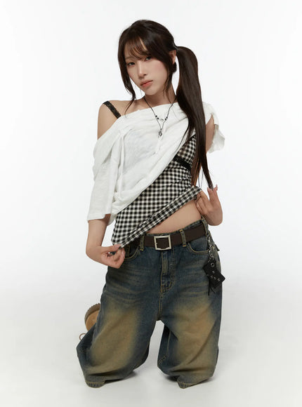 Off-Shoulder Hooded Tee CL508 White full-body front shot on model kneeling, hood draped off-shoulder over gingham top and baggy jeans