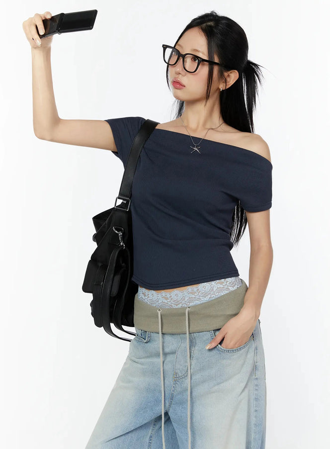 LEWKIN Off-Shoulder Ribbed Short Sleeve Top IU524 Dark blue size S/M front model selfie pose with black crossbody bag styled with light-wash wide-leg jeans