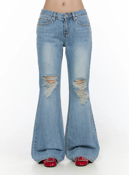 LEWKIN Olynn Low-Rise Distressed Flared Jeans CL513 Light blue front view on model waist-down showing ripped knee details and wide flare hem with red shoes
