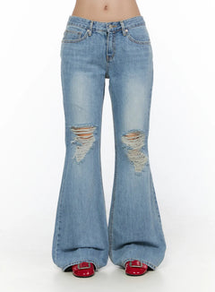 LEWKIN Olynn Low-Rise Distressed Flared Jeans CL513 Light blue front view on model waist-down showing ripped knee details and wide flare hem with red shoes