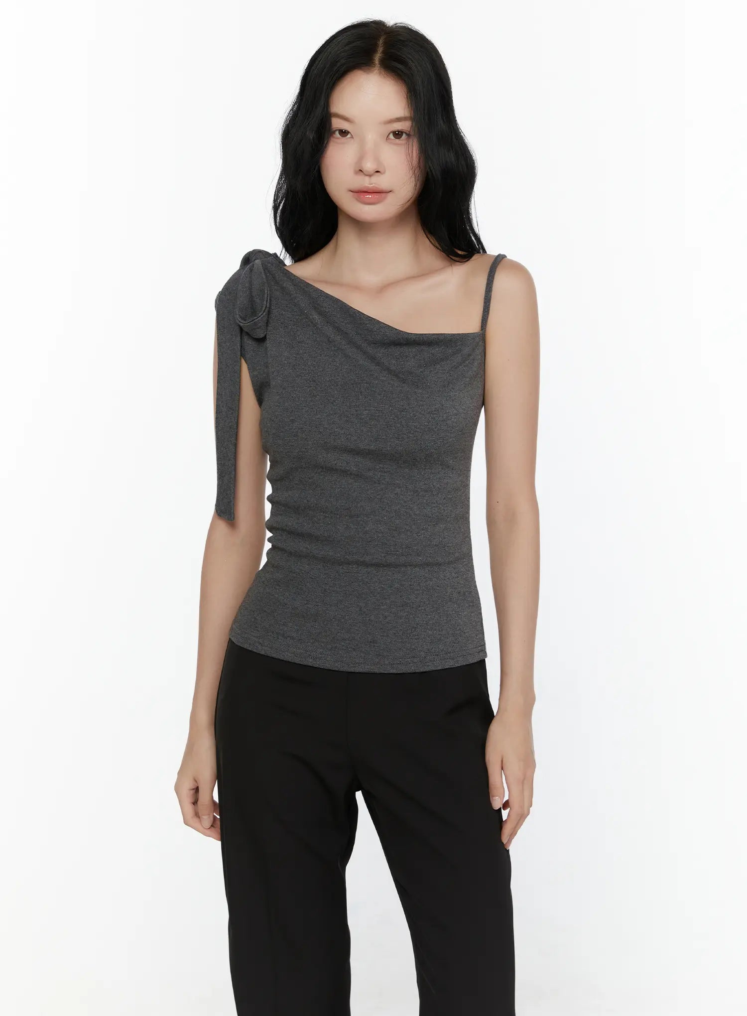 One-Shoulder Bow Top CL521 Dark gray front model waist-up shot arms relaxed repeat front view highlighting asymmetric drape neckline and bow shoulder