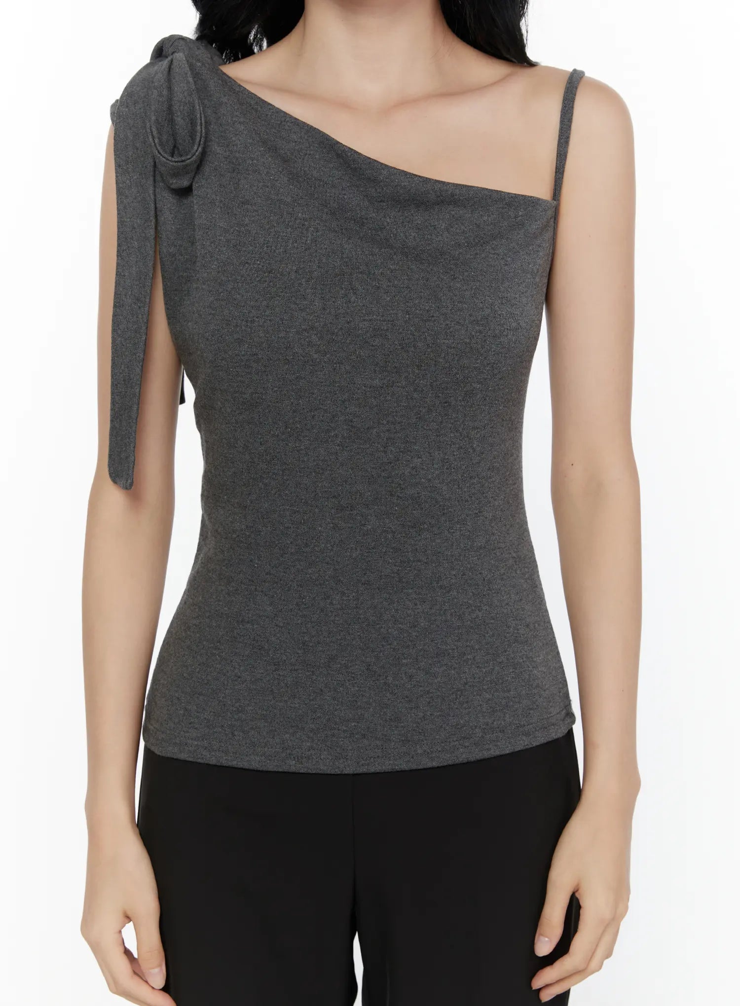 One-Shoulder Bow Top CL521 Dark gray close-up front torso model shot showing asymmetric cowl neckline bow strap detail and soft heathered knit texture