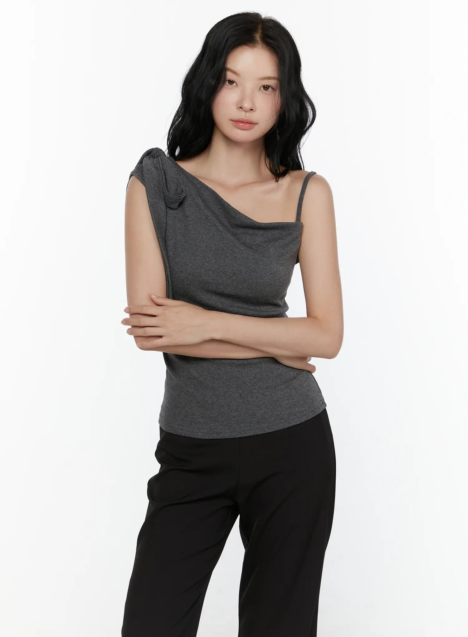 One-Shoulder Bow Top CL521 Dark gray front model half-body shot arms crossed showing compact bow strap and form-fitting heathered knit slightly different angle