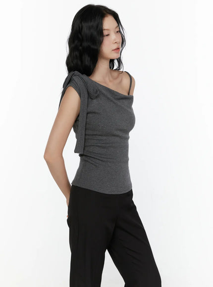 One-Shoulder Bow Top CL521 Dark gray side model half-body shot hand in pocket revealing side silhouette of fitted knit and asymmetric strap bow