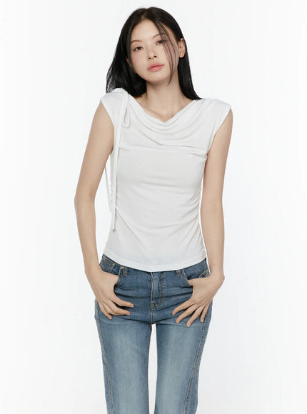 LEWKIN One Shoulder Ribbon Shirred Sleeveless Top IL506 White front shot on model wearing jeans, hands in pockets, cowl neck with shoulder ribbon tie