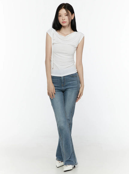 One Shoulder Ribbon Shirred Sleeveless Top IL506 White full-body front shot on model with flare jeans and white heels, relaxed standing pose