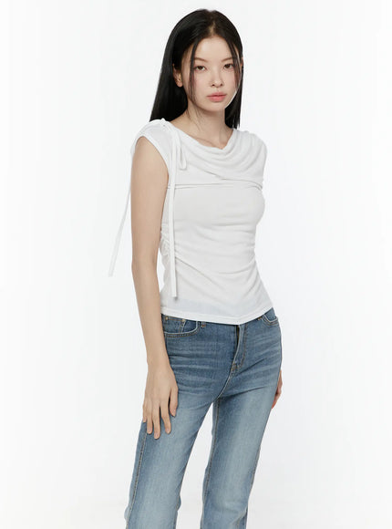 One Shoulder Ribbon Shirred Sleeveless Top IL506 White slight side front shot on model showing ruched side seam and ribbon drawstring detail with jeans