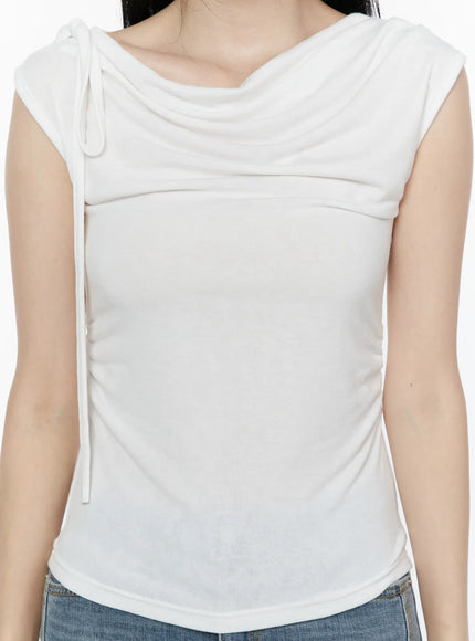 One Shoulder Ribbon Shirred Sleeveless Top IL506 White close-up front torso shot on model showing cowl neckline drape and vertical ruching with ribbon