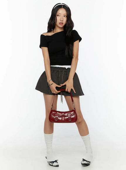 One-Shoulder Shirred Short Sleeve Top CU529 Black full-length front view on model holding red bag with headband white socks and bow flats