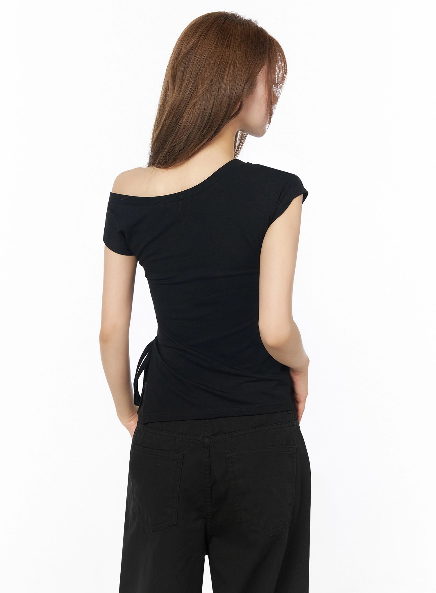One-Shoulder Spiral Top IL502 Black back shot on model showing asymmetric off-shoulder back neckline, ruched fitted back, and side drawstring tie cutout