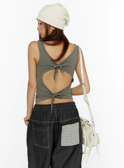 LEWKIN Open-Back Tank Top CL515 Dark green back shot on model wearing beanie hat with open-back cutout and double tie detail, styled with dark denim pants