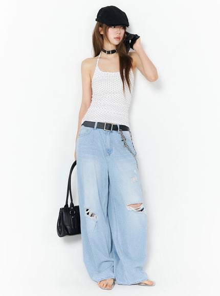 Ophelia Distressed Baggy Jeans IL502 Light blue full-body front shot on model styled with polka-dot cami, black beret, leather gloves, and black tote bag