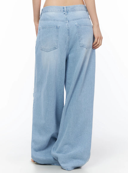 Ophelia Distressed Baggy Jeans IL502 Light blue back crop shot on model showing double patch pockets waistband stitching and faded denim texture
