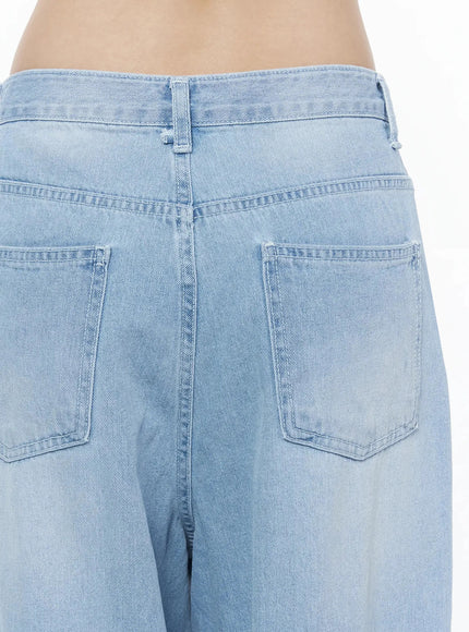 Ophelia Distressed Baggy Jeans IL502 Light blue close-up detail of back yoke double patch pockets and waistband hardware stitching on light blue denim