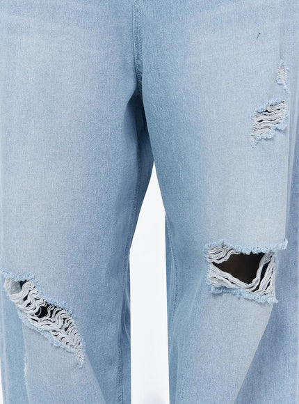 Ophelia Distressed Baggy Jeans IL502 Light blue close-up detail of multiple large distressed rips and frayed edges across both legs of the denim