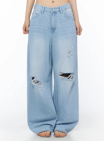 LEWKIN Ophelia Distressed Baggy Jeans IL502 Light blue front crop shot on model showing wide-leg silhouette with large knee rips and frayed distressing