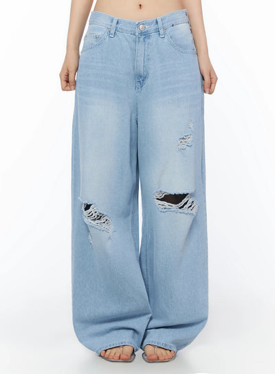 LEWKIN Ophelia Distressed Baggy Jeans IL502 Light blue front crop shot on model showing wide-leg silhouette with large knee rips and frayed distressing