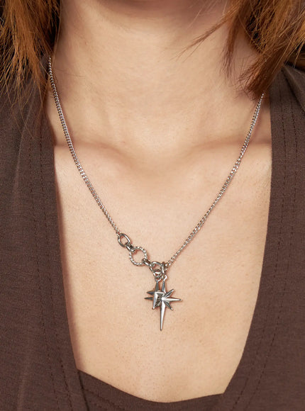 Orion Double Cross Necklace IL517 Silver front close-up on model neck showing double north star pendants on curb chain styled with brown top