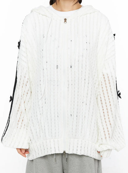 Oversized Bow Detail Windbreaker CU530 White close-up detail shot on model highlighting black double stripe sleeve with ribbon bow accents semi-sheer knit
