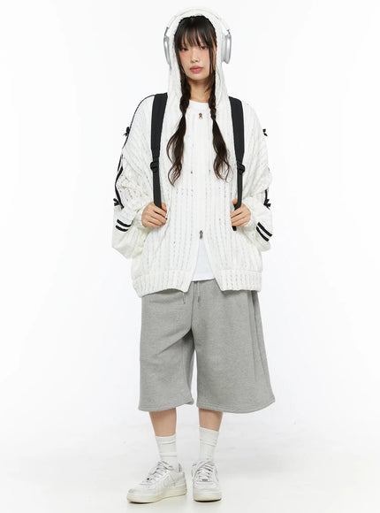 Oversized Bow Detail Windbreaker CU530 White full front shot on model with hood up black backpack gray shorts sneakers open zip semi-sheer knit texture