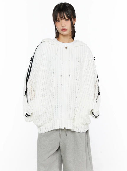 Oversized Bow Detail Windbreaker CU530 White close-up front crop on model showing semi-sheer ribbed knit texture black stripe sleeves bow details zip