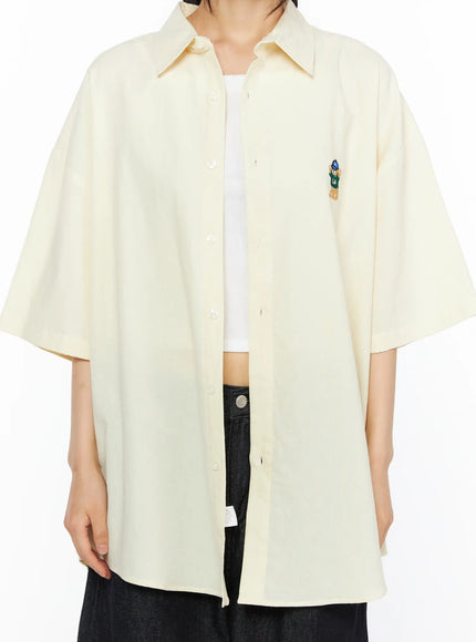 Oversized Button-Up Shirt CU530 Light yellow front torso close-up shot on model displaying point collar button placket and LA bear embroidery chest detail