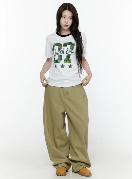 Oversized Cargo Pants IL522 Beige full-body front styled shot on model with arms extended forward showing side pocket placement and balloon leg volume
