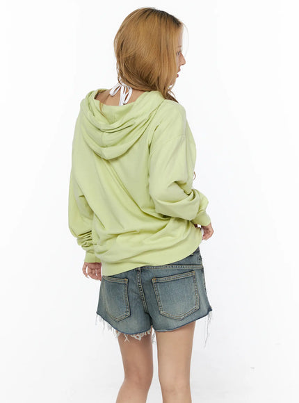 Oversized Cross Graphic Zip-Up Hoodie CL528 Light green back model shot clean plain back hood dropped shoulder oversized fit paired with denim shorts