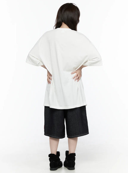 Oversized Kitty Graphic T-Shirt IL516 White back shot female model hands on waist showing plain back panel wide dropped shoulders and curved hem of oversized cotton tee