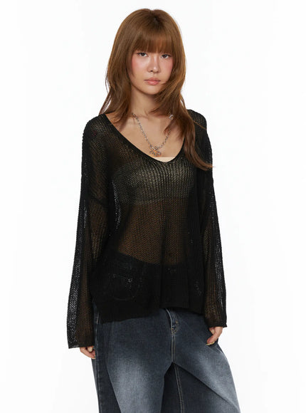 Oversized Knit V-Neck Sweater CL503 Black sheer open-knit front shot on model styled with lace cami and wide-leg jeans