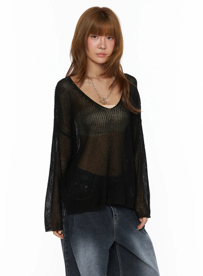 Oversized Knit V-Neck Sweater CL503 Black sheer open-knit front shot on model styled with lace cami and wide-leg jeans