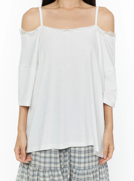 Oversized Lace-Detail Off-Shoulder Tee CU529 White close-up front shot on model cropped at torso showing fringe lace neckline cold-shoulder cut and soft fabric drape