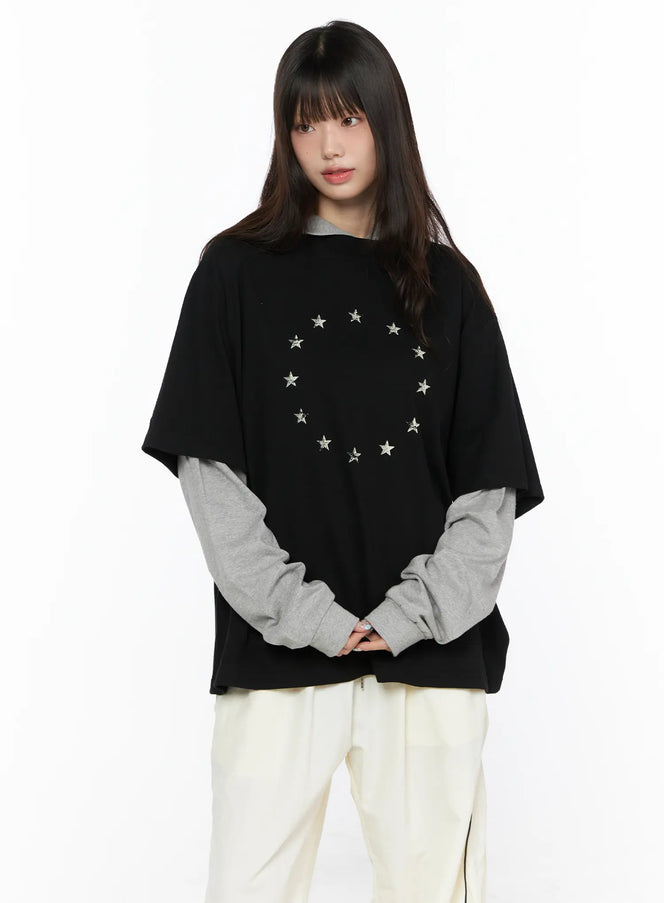 Oversized Layered Tee Striped Hoodie CL523 black front model shot featuring circular silver star print layered over grey long sleeve styled with cream wide-leg pants