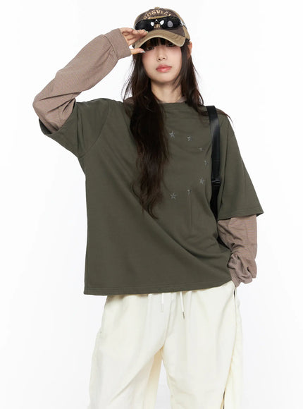 LEWKIN Oversized Layered Tee Striped Hoodie CL523 Dark green front model shot wearing cap and crossbody bag layered over brown striped hoodie with star print