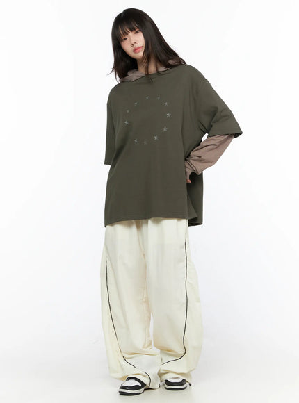 Oversized Layered Tee Striped Hoodie CL523 Dark green full-body front model shot showing circle star graphic layered with brown striped hoodie and cream wide-leg pants