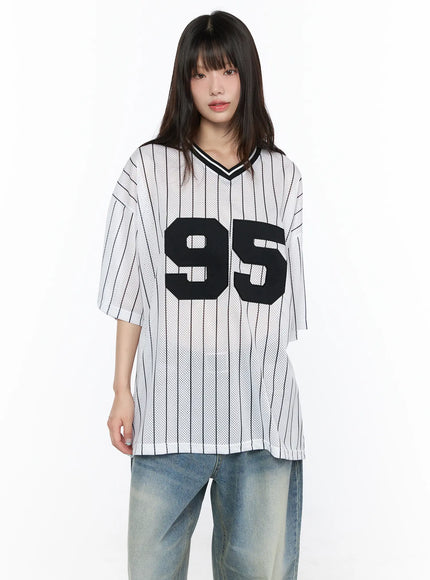 Oversized Mesh Jersey CL523 White front model shot neutral pose showing boxy fit, black 95 applique on pinstripe mesh, V-neck collar, styled with blue jeans