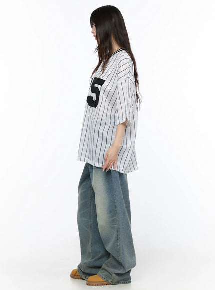 Oversized Mesh Jersey CL523 White side model shot showing boxy silhouette, pinstripe mesh fabric drape, curved hem, styled with wide-leg jeans