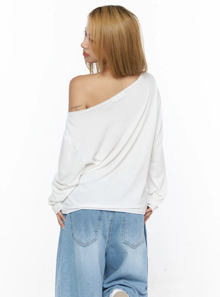 Oversized Off-Shoulder Graphic Long Sleeve Top CL528 White back model shot showing plain white relaxed back silhouette, dropped shoulder seam, and long sleeve drape
