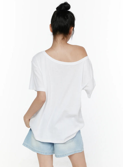 Oversized Off-Shoulder Tee CL520 White back shot on model showing wide scoop back neckline dropped shoulders and relaxed cotton hem paired with denim shorts