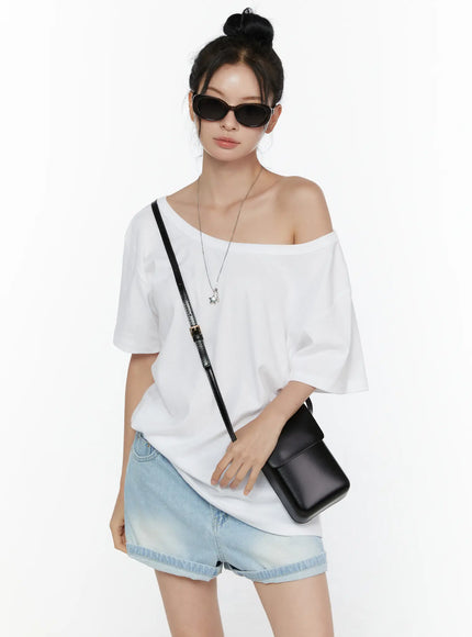 LEWKIN Oversized Off-Shoulder Tee CL520 White S/M front shot on model styled with denim shorts black crossbody bag and sunglasses relaxed cotton silhouette