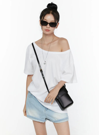 LEWKIN Oversized Off-Shoulder Tee CL520 White S/M front shot on model styled with denim shorts black crossbody bag and sunglasses relaxed cotton silhouette