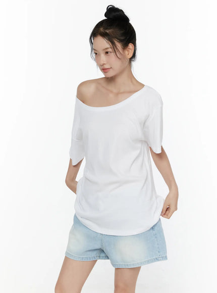 Oversized Off-Shoulder Tee CL520 White three-quarter front shot on model wearing denim shorts hands at sides showing clean oversized cotton front panel