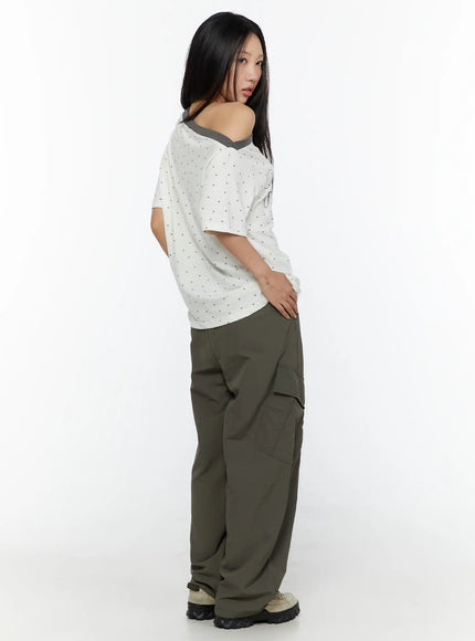 Oversized Polka Dot Off-Sholder Tee CU526 White back side shot model looking over shoulder revealing star dot texture gray diagonal neckline detail and curved hem