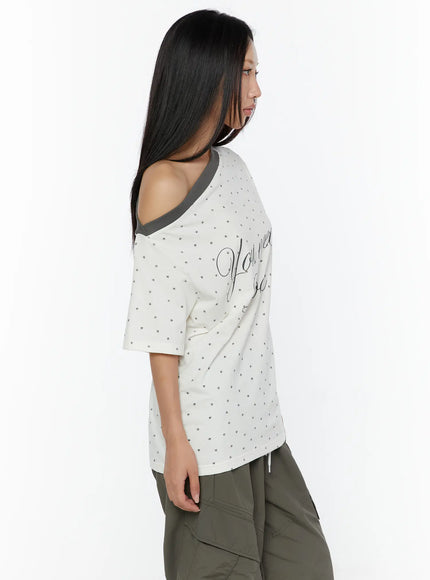 Oversized Polka Dot Off-Sholder Tee CU526 White close-up side shot model highlighting asymmetric off-shoulder neckline star print fabric and short sleeve length